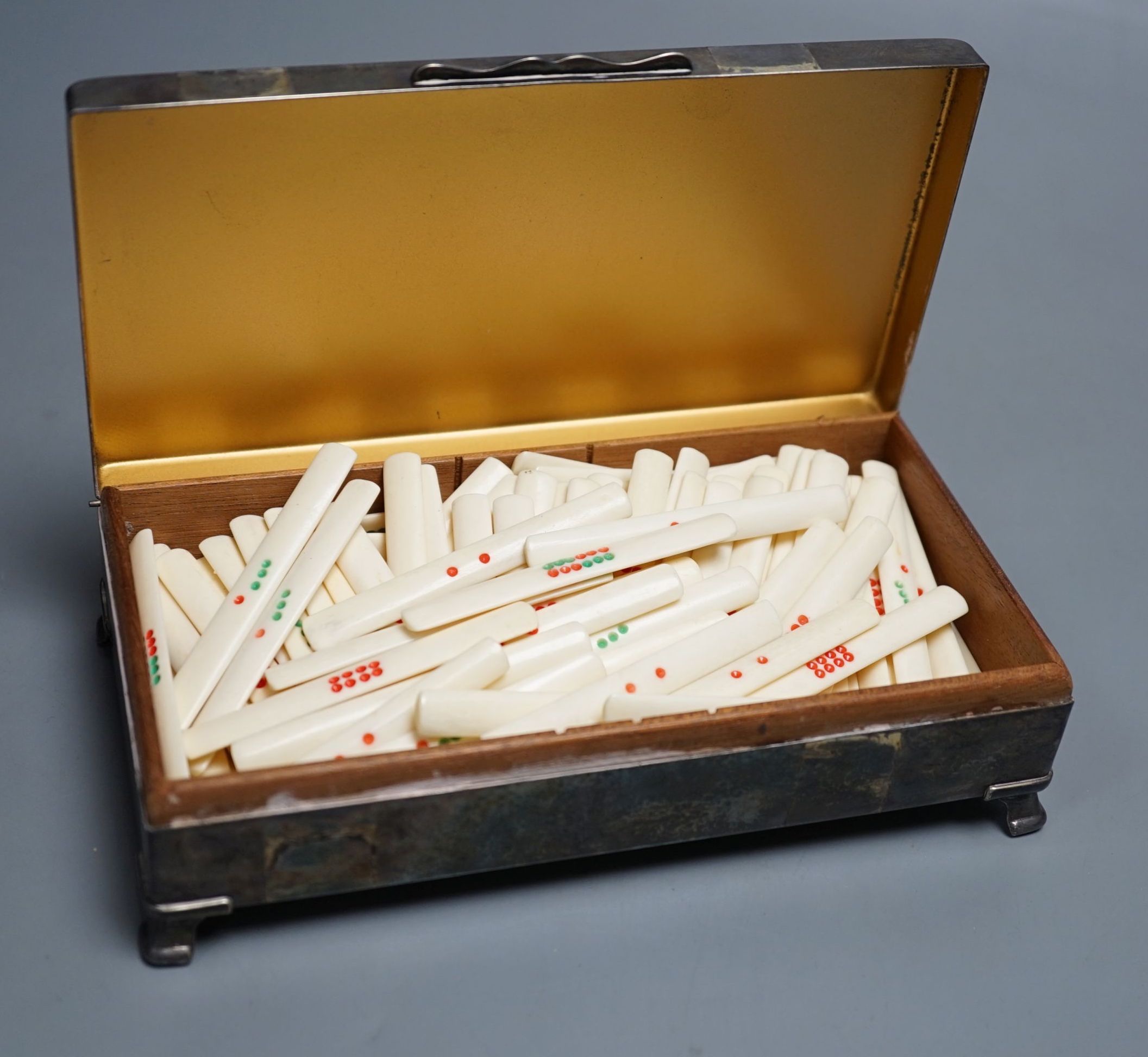 Bone set game markers, in a plated box.